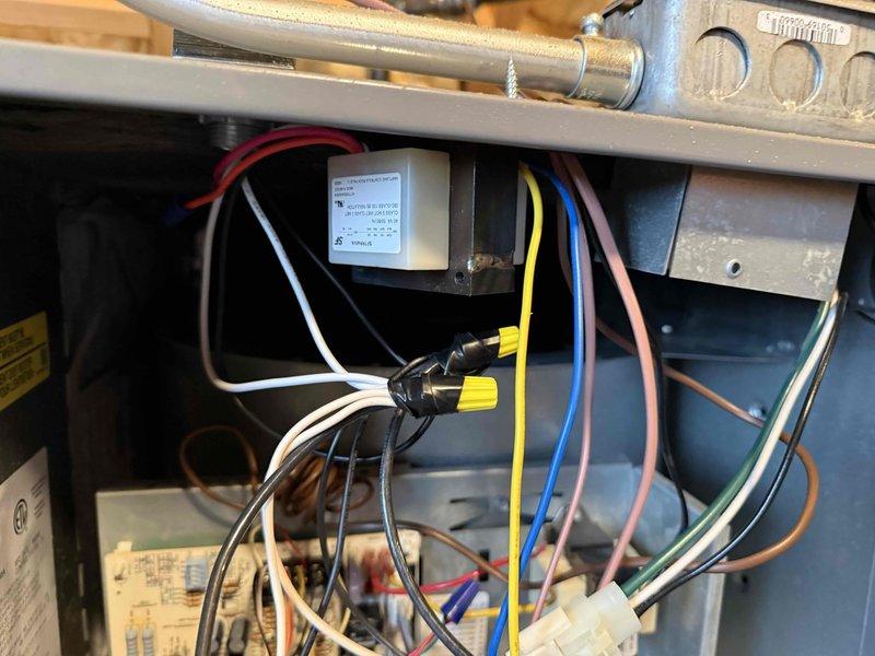 Performed comprehensive clean and check maintenance on residential air conditioning system and air scrubber unit per comfort plan agreement. Inspected all electrical connections, wiring harnesses, and control components within the air handler compartment, verifying proper wire terminations and secure connections throughout. Examined blower assembly, capacitor, and associated mechanical components for proper operation. Addressed concern regarding air scrubber indicator light status and verified system functionality. All safety labels and manufacturer specifications were reviewed, and unit was found to be operating within normal parameters upon completion of maintenance service.