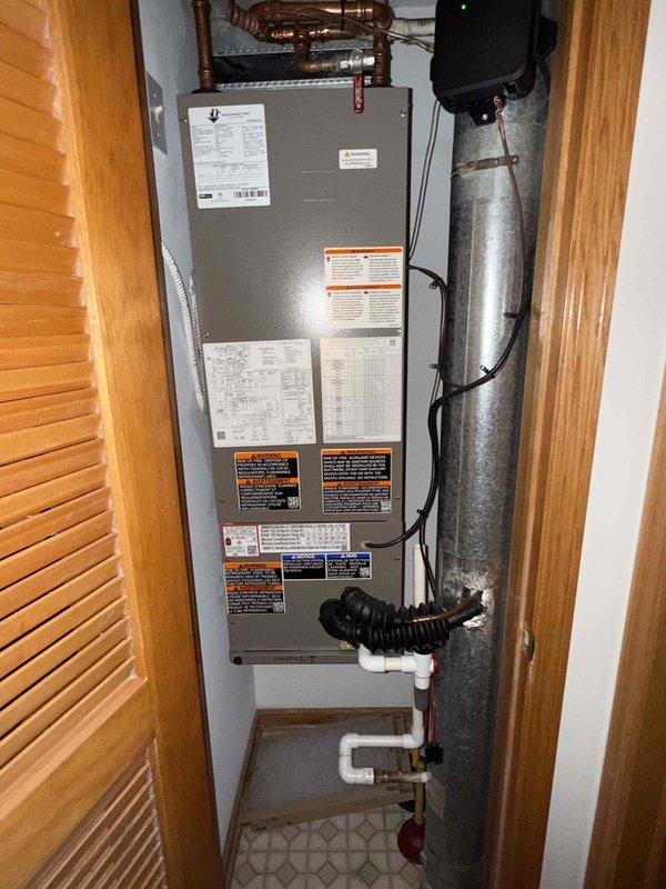 Completed comprehensive tune-up service on single-system HVAC unit consisting of air handler located in interior utility closet. Performed standard maintenance procedures including electrical testing with digital multimeter to verify proper voltage and amperage across control circuits, inspected refrigerant line connections and insulation integrity, checked condensate drain system operation, and replaced air filter. All components found operating within manufacturer specifications with no deficiencies noted.