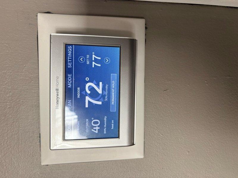 Responded to return service call for heating system with inadequate heat delivery to front of home. Diagnosed air trapped in hydronic heating system as primary cause of reduced hot water circulation. Performed system purge to remove air from piping, restoring proper hot water flow and heat distribution throughout residence. System now operating normally with improved circulation to all zones.