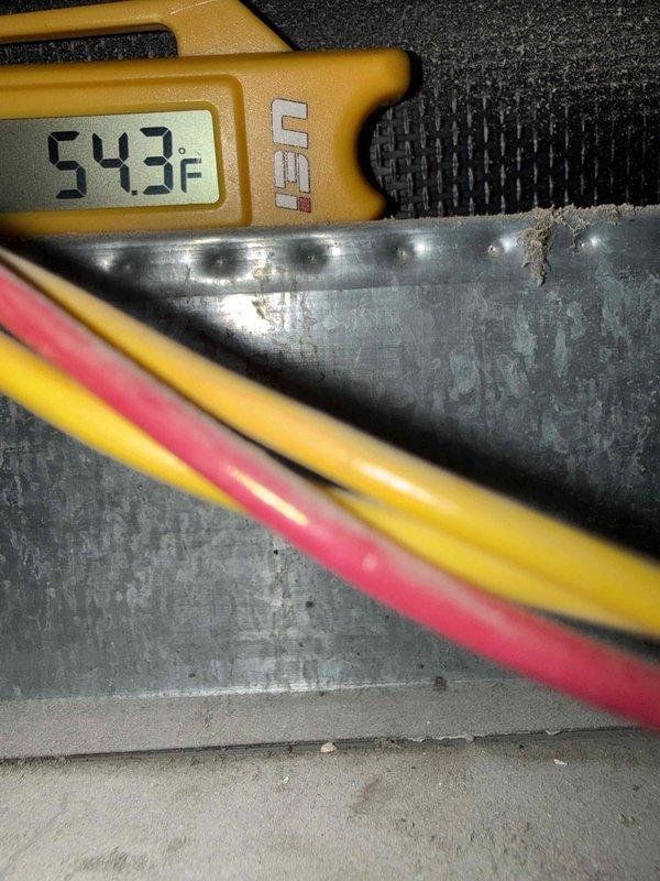 Completed comprehensive tune-up maintenance on 2.5-ton air conditioning system and air handler unit. Performed diagnostic testing using digital multimeter and clamp meter, verifying electrical parameters and system performance. Measured supply air temperature at 54.3°F, confirming proper cooling operation. Inspected condenser unit, electrical connections, and ductwork components. System operating within normal specifications with no immediate repairs required at time of service.