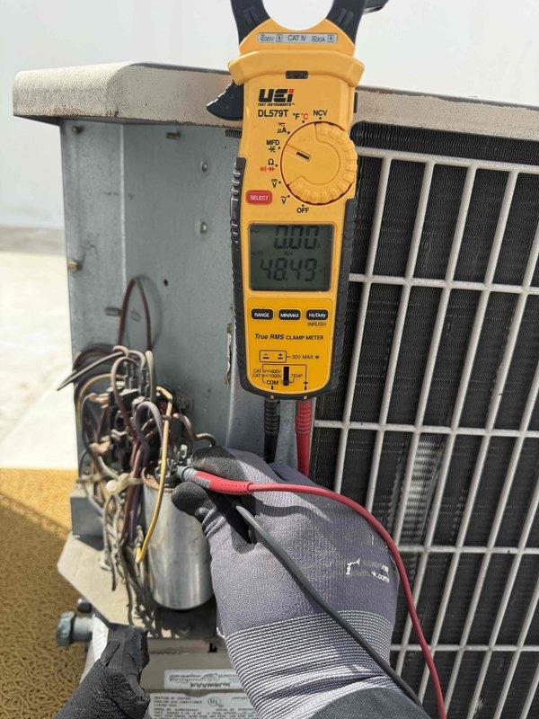 Completed comprehensive tune-up maintenance on 2.5-ton air conditioning system and air handler unit. Performed diagnostic testing using digital multimeter and clamp meter, verifying electrical parameters and system performance. Measured supply air temperature at 54.3°F, confirming proper cooling operation. Inspected condenser unit, electrical connections, and ductwork components. System operating within normal specifications with no immediate repairs required at time of service.