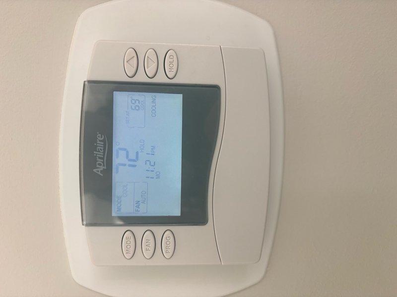 Completed comprehensive clean and check maintenance service on two air conditioning systems per comfort plan agreement. Performed diagnostic testing on outdoor condenser units, including electrical measurements and system performance verification using testing equipment. Inspected condenser coils, cleaned components as needed, and verified proper operation of both systems. Confirmed thermostat functionality showing system operating in cooling mode at 72°F setpoint. Both AC units tested and found operating within normal parameters with no immediate repairs required at time of service.