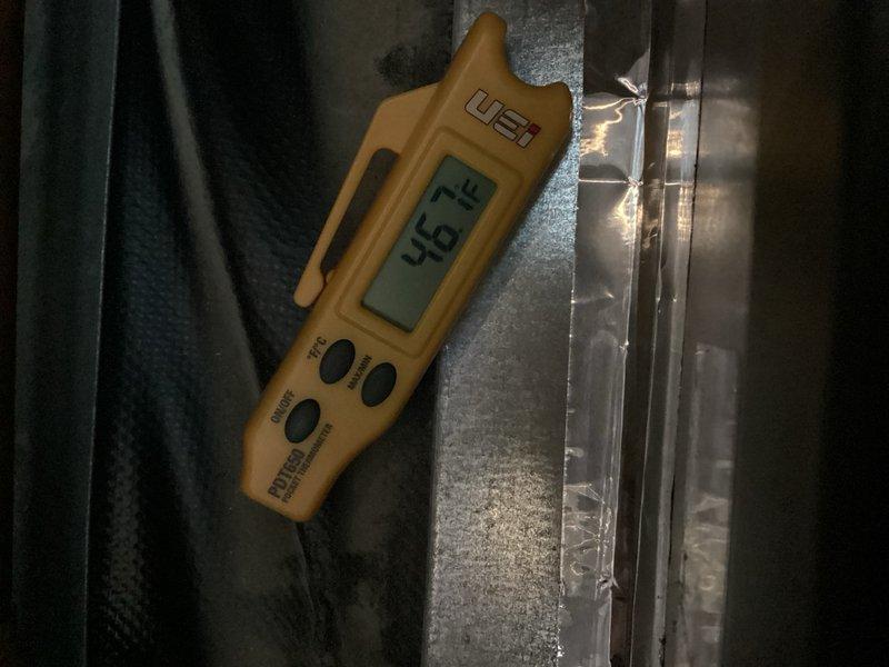 Returned to complete A/C installation by charging the refrigerant system to proper levels and reinstalling thermostat that had become dislodged. Addressed excessive noise concerns from the outdoor unit and verified system operation. Control board wiring connections were inspected and secured, with proper wire terminations confirmed at all connection points. System was tested and verified operating at 46.7°F supply air temperature, indicating adequate refrigerant charge and proper system performance. All electrical connections at the control board, including relay circuits and wire terminations, were verified secure and functioning correctly.
