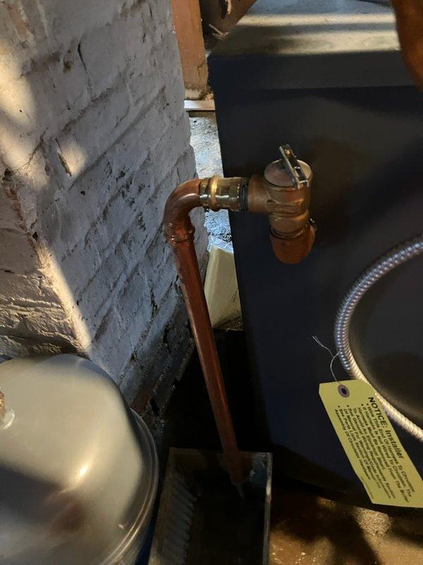Responded to emergency service call for water leaking from copper pipe on boiler system. Upon arrival, inspected boiler and associated plumbing components, including pressure relief valve assembly and copper piping configuration. Identified source of water discharge from temperature and pressure relief valve. Assessed valve operation, brass fittings, and flexible connector assembly to determine cause of leak. Documented equipment information and current system conditions. Discussed findings with customer regarding pressure relief valve function and recommended repair options to resolve active water leak and prevent potential basement flooding.