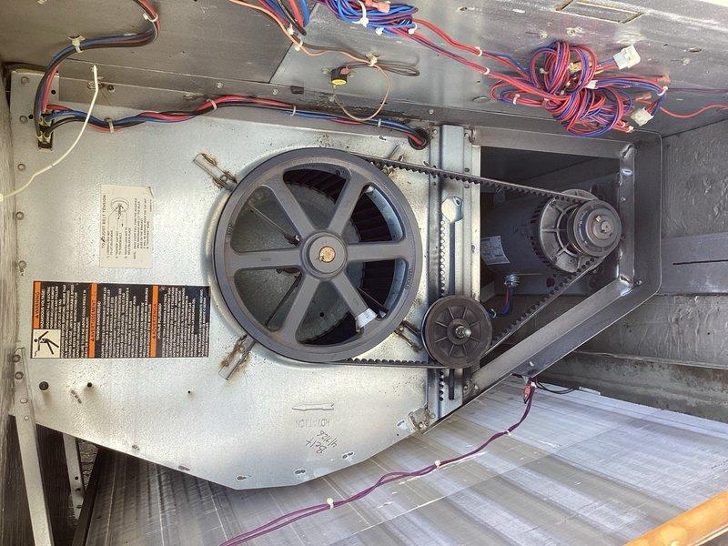 Performed preventive maintenance on two rooftop HVAC units under commercial maintenance agreement. Replaced drive belts on both RTU blower assemblies to ensure proper operation and prevent system failures. Verified belt tension and alignment on pulley systems. Documented equipment condition with thermal imaging readings showing 57.5°F at baseboards and photographed belt drive components including motor assembly, pulleys, and wiring connections. Collected outstanding balance on service agreement invoice.