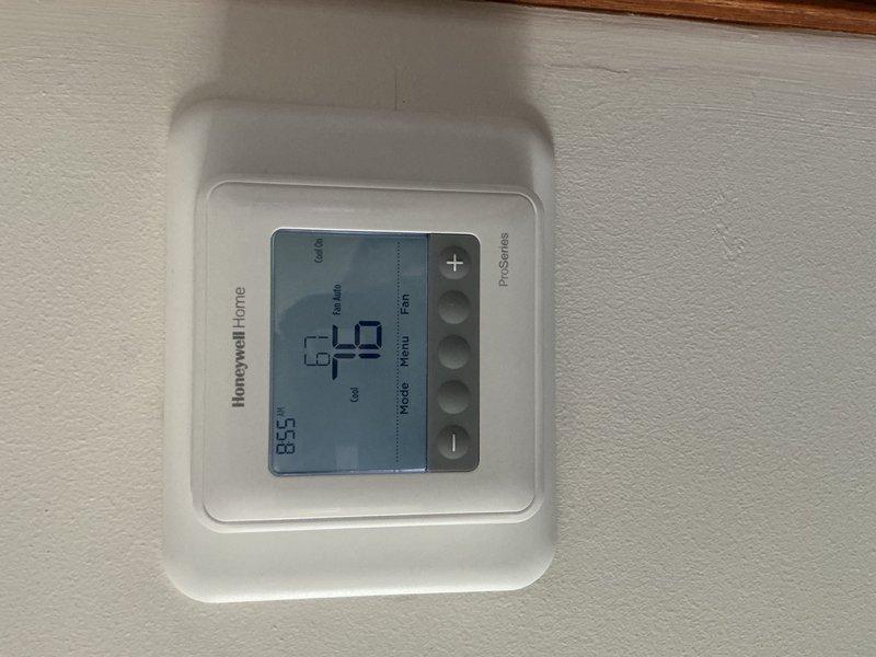 Completed preventive maintenance tune-up on single-system air conditioning unit. Verified thermostat operation showing 79°F ambient temperature, performed electrical diagnostics with multimeter reading 25.83 volts at condenser unit, and inspected evaporator coil. Customer will contact office regarding air filter replacement needs.