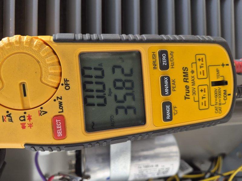 Completed preventive maintenance tune-up on single-system air conditioning unit. Verified thermostat operation showing 79°F ambient temperature, performed electrical diagnostics with multimeter reading 25.83 volts at condenser unit, and inspected evaporator coil. Customer will contact office regarding air filter replacement needs.