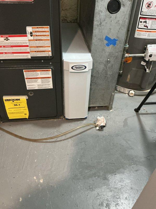 Provided consultation and assessment for installation of return air filter cabinet integration with existing HVAC system. Evaluated manufacturer specifications confirming inlet and outlet openings measure 23 7/8" deep, with opening beginning 1" from cabinet back, resulting in total depth of approximately 24 7/8" from rear of cabinet. Determined cabinet and door assembly would extend beyond existing return ductwork configuration. Confirmed installation feasibility and documented existing equipment including high-efficiency furnace with 96.1 AFUE rating and Aprilaire humidification system. Photographed current mechanical room layout and equipment configuration for installation planning purposes.