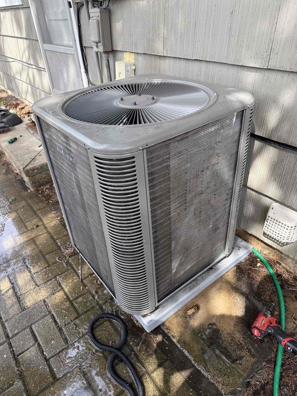 Completed spring preventative maintenance on residential air conditioning system per comfort plan agreement. Performed comprehensive clean and check procedures on outdoor condensing unit, including visual inspection of cabinet condition, verification of proper airflow through louvers and fan grille, and electrical diagnostics using clamp meter to measure amperage draw and capacitor performance. All components tested within normal operating parameters with amperage reading of 0.81 amps recorded at time of inspection.