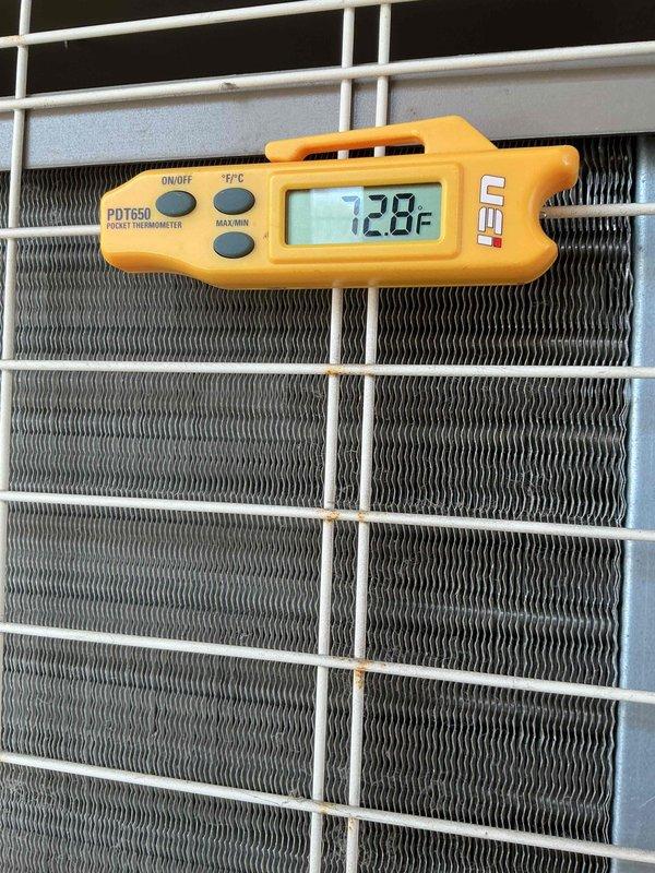 Completed Silver Comfort Plan clean and check service on air conditioning system. Performed comprehensive inspection including electrical diagnostics with multimeter readings, temperature measurements across heat exchanger components registering 72.8°F, and visual assessment of condenser coil condition. All system components tested and operating within normal parameters, with comfort plan renewal collected on-site as requested.