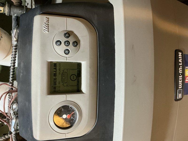 Responded to ongoing issue with three-zone hydronic heating system experiencing unwanted heat transfer to upper floor when basement zone calls for heat. Inspected Caleffi zone control board (previously replaced under warranty) and documented control panel wiring, relay configuration, and Weil-McLain boiler control interface. Investigated potential flowcheck valve bypass condition that may be allowing heated water to circulate improperly between zones, collected diagnostic information and photographs for technical support consultation to determine if zone control board malfunction is contributing to cross-zone heating issue.