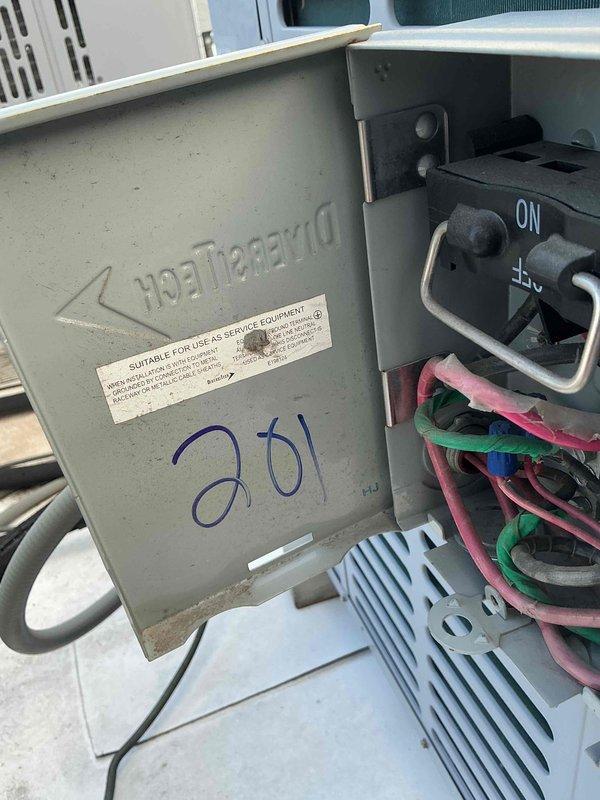 Completed scheduled commercial preventive maintenance inspection per service agreement. Performed electrical diagnostics using digital multimeter, testing capacitor and verifying proper voltage readings at 6.18 on system components. Inspected DiversiTech disconnect panel, confirmed all electrical connections secure, and verified proper operation of safety disconnect switch. Unit operating within normal parameters, no deficiencies noted.