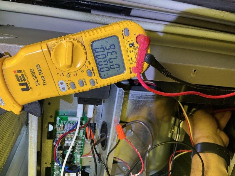 Performed diagnostic evaluation on air handler unit. System found operational with no air filter installed at time of inspection. Utilized digital multimeter to verify electrical readings at control board and measured capacitor performance within acceptable parameters. Inspected internal electrical components including contactor, capacitor, and control circuitry connections. All wire terminations and safety controls verified secure and functioning properly. Unit operational but requires air filter installation for proper system protection and efficiency.