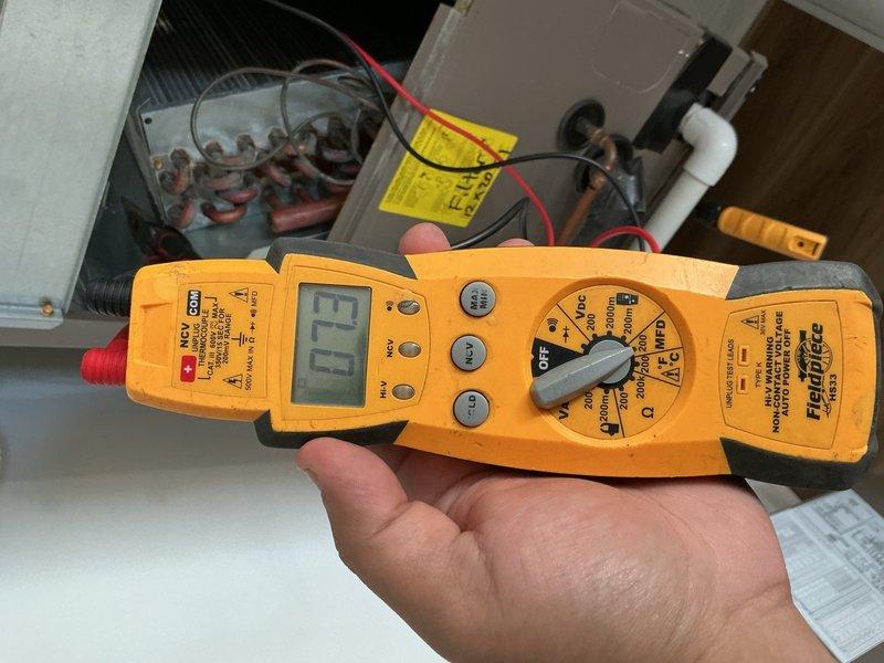 Completed spring preventive maintenance and tune-up on rooftop air conditioning system. Performed comprehensive inspection of electrical components including capacitors and wiring connections, verified system operation with digital multimeter readings, and documented equipment condition through photographic records. All components found to be in functional condition with normal wear for outdoor installation.