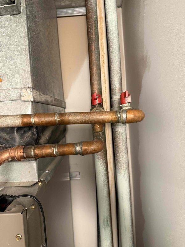 Completed comprehensive tune-up on single HVAC system including air conditioning and air handler units. Performed standard maintenance procedures, system diagnostics with clamp meter showing operational amperage at 7.39, and visual inspection of all accessible components including copper refrigerant lines with shutoff valves, ductwork, blower motor assembly, and electrical connections. All components found operating within normal parameters, and system left in proper working condition.