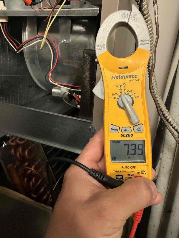 Completed comprehensive tune-up on single HVAC system including air conditioning and air handler units. Performed standard maintenance procedures, system diagnostics with clamp meter showing operational amperage at 7.39, and visual inspection of all accessible components including copper refrigerant lines with shutoff valves, ductwork, blower motor assembly, and electrical connections. All components found operating within normal parameters, and system left in proper working condition.