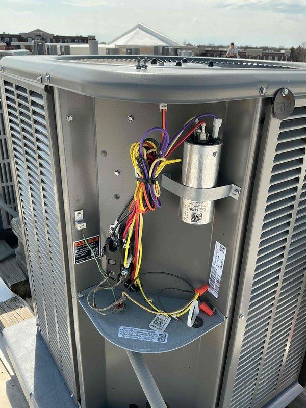 Performed comprehensive tune-up on single HVAC system including air conditioning and air handler units. Conducted electrical diagnostics using digital multimeter to verify proper voltage and amperage readings across system components. Inspected and tested capacitor, motor assembly, and all electrical connections with particular attention to wiring harnesses and terminations. Verified proper operation of blower assembly and confirmed all safety labels and specifications were legible. System tested and found operating within normal parameters. Customer provided their own air filter for installation. All components checked, cleaned, and confirmed in good working condition.