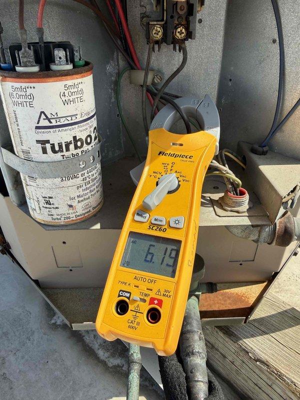 Performed scheduled commercial preventive maintenance inspection on rooftop air conditioning unit per service agreement. Conducted electrical diagnostics using clamp meter, verified capacitor operation at 5mfd rating, and inspected all electrical connections and components. Unit found operating within normal parameters with all systems functioning properly.