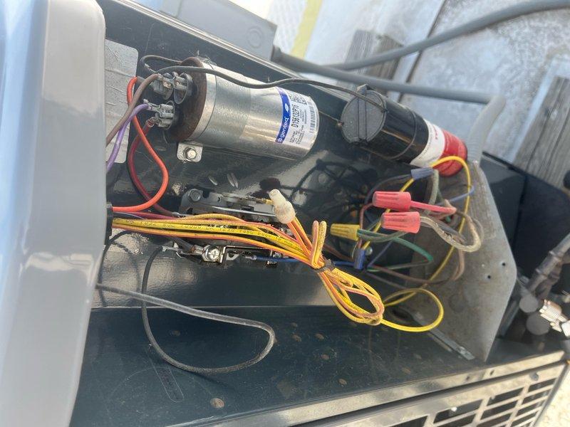 Completed commercial air conditioning clean and check maintenance per service agreement. Inspected electrical components, capacitor, and wiring connections; verified proper operation of all system components and documented unit condition with photos.