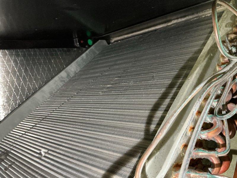 Completed standard tune-up maintenance on single-system HVAC unit. Performed comprehensive inspection of air handler and condensing unit, documenting equipment condition with photos showing evaporator coil with accumulated dirt and debris, oxidized copper refrigerant lines with visible patina, control board, blower assembly, and internal components. System operational at time of service. Customer maintains their own filtration.