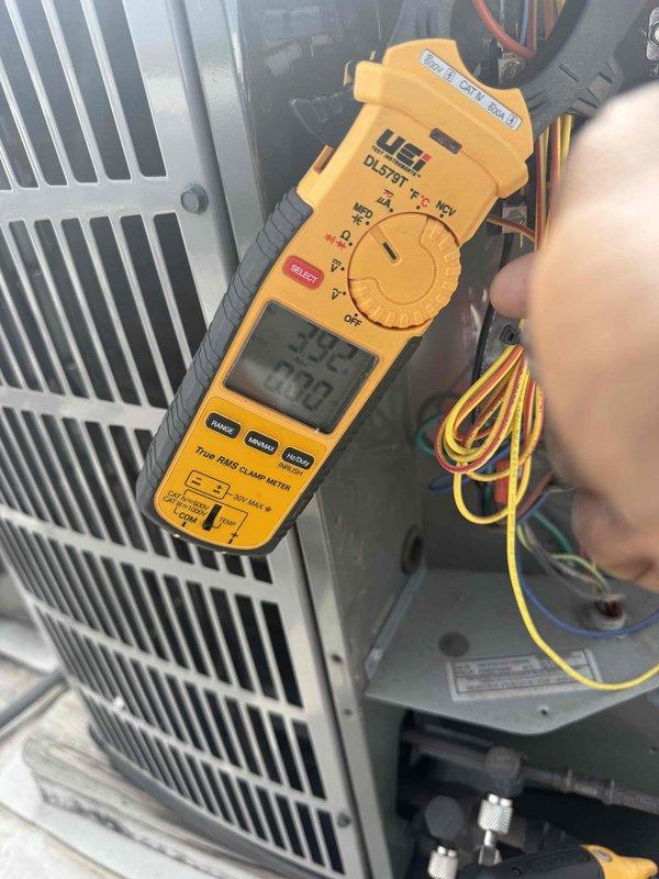 Performed commercial air conditioning clean and check maintenance per service agreement. Conducted electrical diagnostics using digital clamp meter, verifying system amperage and capacitance readings on outdoor condensing unit. Inspected all electrical connections, wiring, and components for proper operation and documented equipment conditions with photos for service records.