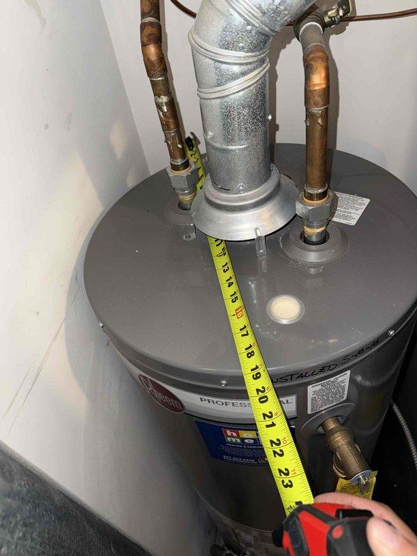 Completed spring clean and check on air conditioning system per comfort plan maintenance agreement. Inspected evaporator coil and found moderate dust and debris accumulation between fins, which can reduce system efficiency and airflow. Additionally, performed diagnostic inspection of 10-year-old water heater per customer request, documenting unit dimensions and current condition with photographs for service records.