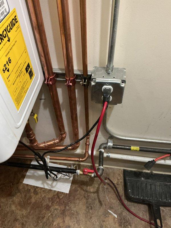 Completed comprehensive plumbing and HVAC system integration work at residential property. Piped 1/2" recirculation line into tankless water heater and connected to main recirculation line, replacing unistrut clamps with cushion clamps for proper support. Removed two temporary 1/2" ball valves previously installed for shower, capped cold line, and installed 1/4" compression x 1/2" compression angle stop on hot line for humidifier connection. Reworked condensate drain system for AC coil and humidifier to ensure proper drainage. Rerouted ERV flex lines to run over main hot and cold water lines, eliminating interference issues. Connected ERV 2-wire control wiring from energy recovery ventilator unit and ran to interface module location. Completed electrical wiring of interface module to control ERV and humidifier operation. Programmed thermostat to communicate with interface module for integrated system control. Programmed tankless water heater settings to properly operate recirculation p
