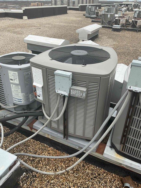 Completed comprehensive tune-up service on rooftop commercial HVAC system including air conditioning condenser unit and air handler. Performed standard maintenance protocol: inspected all mechanical components, checked refrigerant lines and connections, verified proper operation of condenser fan and motor, examined electrical connections and controls, tested system performance parameters, and replaced air filter. All equipment found operating within normal specifications with no deficiencies noted at time of service.