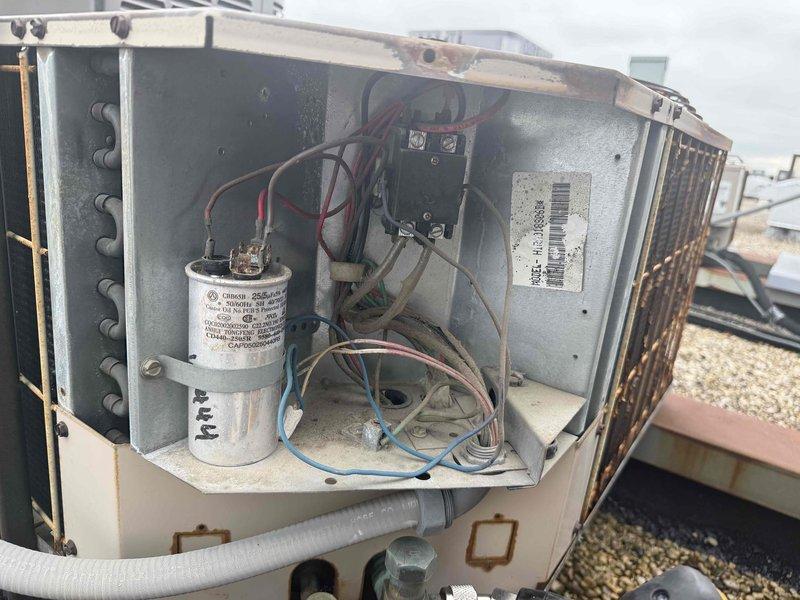 Completed comprehensive tune-up on rooftop air conditioning system for new customer. Performed standard maintenance procedures including system diagnostics with multimeter, electrical component inspection of capacitor and contactor assembly, and installed new 12x20x1 air filter. All components tested within normal operating parameters and system returned to service.