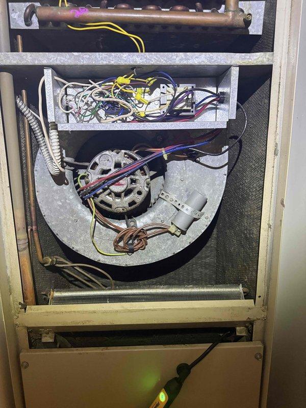 Completed comprehensive clean and check service on air conditioning system and air handler unit. Performed thorough inspection of internal components including blower assembly, evaporator coil, electrical connections, and wiring harnesses. Tested capacitor functionality and verified electrical readings using digital clamp meter, confirming all values within normal operating parameters. All mechanical and electrical components found operating properly with no deficiencies noted.