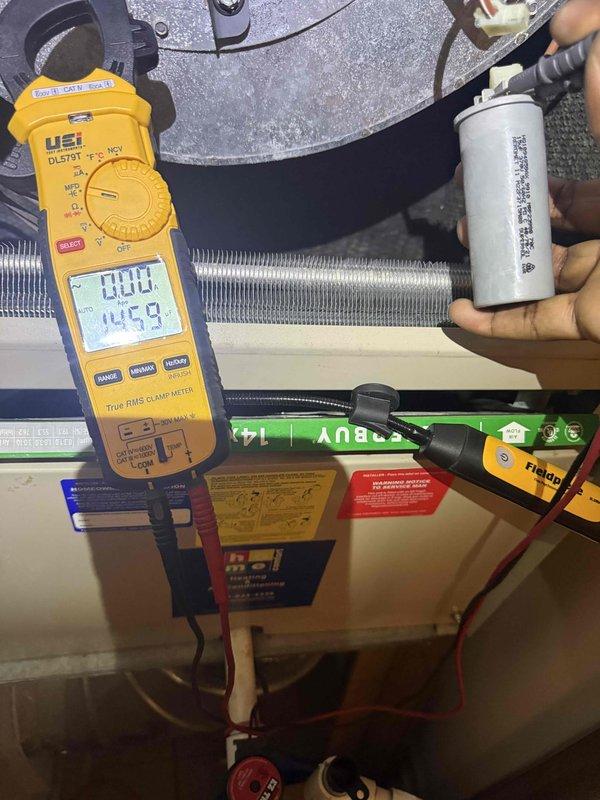 Completed comprehensive clean and check service on air conditioning system and air handler unit. Performed thorough inspection of internal components including blower assembly, evaporator coil, electrical connections, and wiring harnesses. Tested capacitor functionality and verified electrical readings using digital clamp meter, confirming all values within normal operating parameters. All mechanical and electrical components found operating properly with no deficiencies noted.