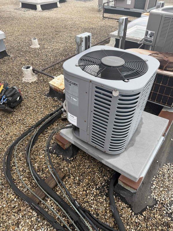 Completed preventive maintenance tune-up on single-system rooftop EcoGuide air conditioning unit. Performed comprehensive electrical diagnostics using clamp meter, measuring amperage draws and verifying proper electrical operation of compressor and fan motor circuits. Inspected capacitor condition, refrigerant line connections, and overall system components. Unit operating within normal parameters; customer provided own filter for replacement. System checked and cleared for continued operation.