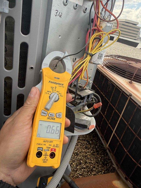 Completed comprehensive tune-up service on single AC/AH system. Inspected blower wheel assembly and verified proper operation, noting minor dust accumulation on squirrel cage fan blades. Performed electrical diagnostics using clamp meter to verify system amperage and proper voltage delivery to outdoor condensing unit. Inspected condenser coil condition, electrical connections, and wiring integrity at outdoor unit. All components operating within normal parameters upon completion of maintenance service.