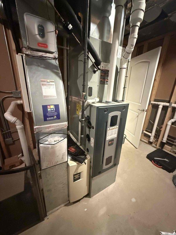 Completed annual Comfort Plan maintenance on two air conditioning systems including clean and check procedures. Inspected and serviced indoor air handlers in basement mechanical room, replaced media filters on both units, and performed full system diagnostics. Addressed customer request to re-level exterior condensing unit that had settled, ensuring proper drainage and operational efficiency. All systems tested and confirmed operational upon completion.