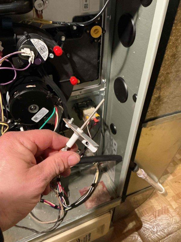 Completed comprehensive clean and check maintenance on residential HVAC system including furnace, humidifier, water heater, and media filter per comfort plan agreement. Performed detailed inspection of furnace components with flame sensor removal and cleaning to ensure proper combustion detection and system safety. Disassembled and inspected water heater burner assembly, cleaned combustion chamber, and verified thermostat operation and pilot light functionality. All systems tested and returned to proper working condition.