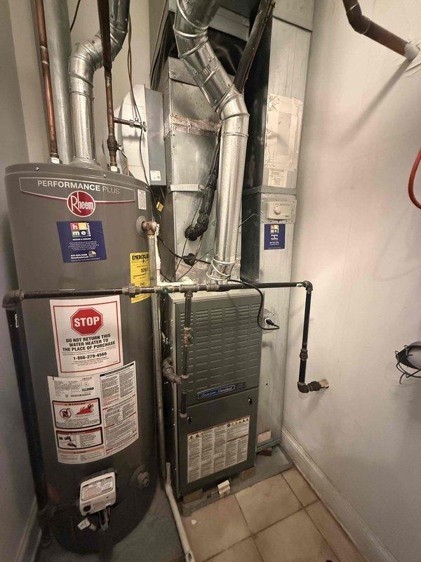 Completed Comfort Plan clean and check maintenance on 14-year-old residential air conditioning system. Performed comprehensive inspection of indoor furnace unit and outdoor condensing unit, including visual assessment of electrical connections, refrigerant lines, and ductwork. Measured electrical parameters using clamp meter to verify proper system operation and component performance within manufacturer specifications.