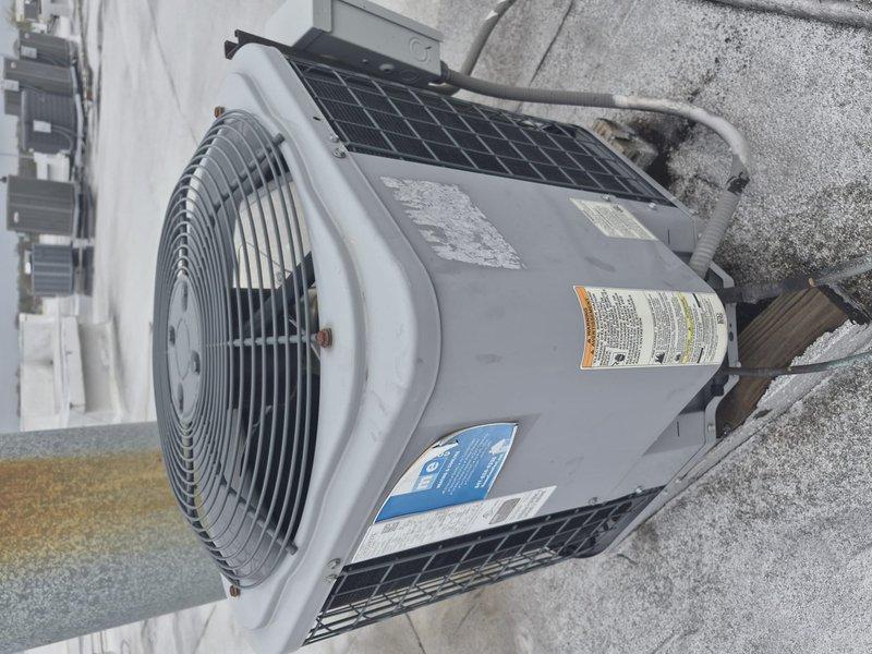 Completed comprehensive tune-up on single-system rooftop HVAC unit, performing standard maintenance protocol including filter replacement and system diagnostics. Utilized digital multimeter to verify electrical readings on capacitor and related components, confirming proper system operation. Collected payment as requested and documented equipment condition with photos showing outdoor condensing unit and electrical measurements.