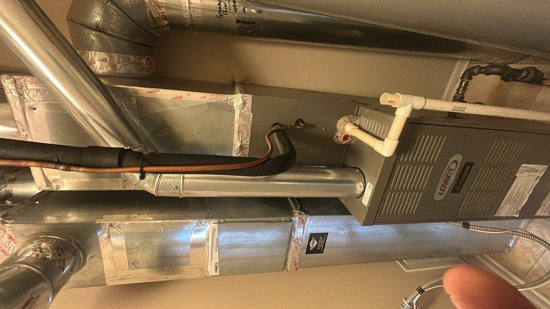 Completed full system replacement estimate for 16-year-old HVAC system in townhouse configuration with outdoor AC unit located on balcony and Lennox furnace positioned in utility closet. Documented existing installation including ductwork, refrigerant lines, condensate drainage system, and gas connections to provide comprehensive replacement specifications for complete heating and cooling system upgrade.