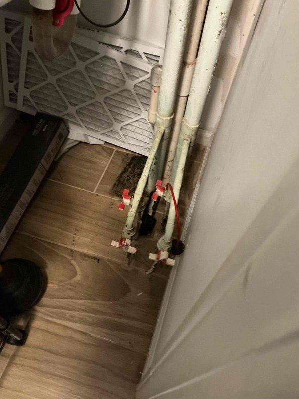 Completed return visit to address unwanted warm air discharge from HVAC system. Located and closed isolation valves on heating system piping to prevent hot water circulation to air handler during cooling season. Verified proper valve operation and confirmed no heat transfer occurring through system after valve closure. Customer concern resolved.