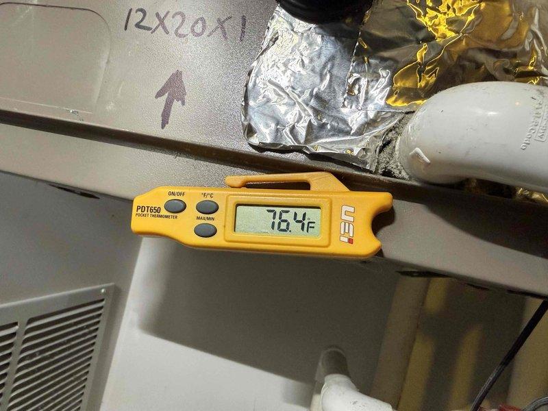 Completed comprehensive tune-up on single HVAC system including air conditioning and air handler units. Performed thorough cleaning of evaporator coil which showed significant accumulation of dirt, dust, and debris throughout the heat exchanger fins. Documented system temperatures with infrared thermometer reading 76.4°F at supply plenum. Verified system operation and confirmed all components functioning properly. Customer declined filter replacement and will provide their own 12x20x1 filter. System left in clean and operational condition.