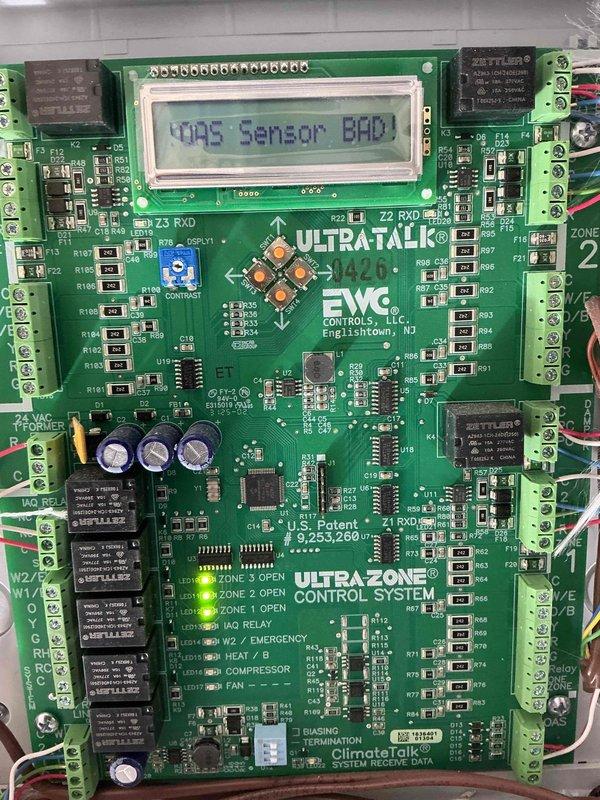 Responded to callback for second floor air conditioning system that was inoperative. Upon inspection, found UltraZone control system displaying "VAS Sensor BAD!" error on LCD screen. Diagnosed failed velocity air sensor preventing proper zone operation. Replaced defective sensor and verified dual Amana outdoor units were functioning correctly with proper communication to zone control board. System restored to full operation with all zones cooling properly.