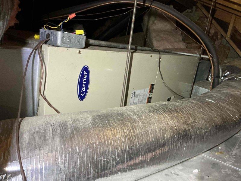 Completed comprehensive clean and check maintenance on single-system HVAC equipment per comfort plan agreement, including rooftop condensing unit and attic-mounted Carrier air handler. Performed electrical testing with clamp meter on outdoor unit, inspected refrigerant lines, verified proper operation of all components, and documented system condition with photographs for service records.
