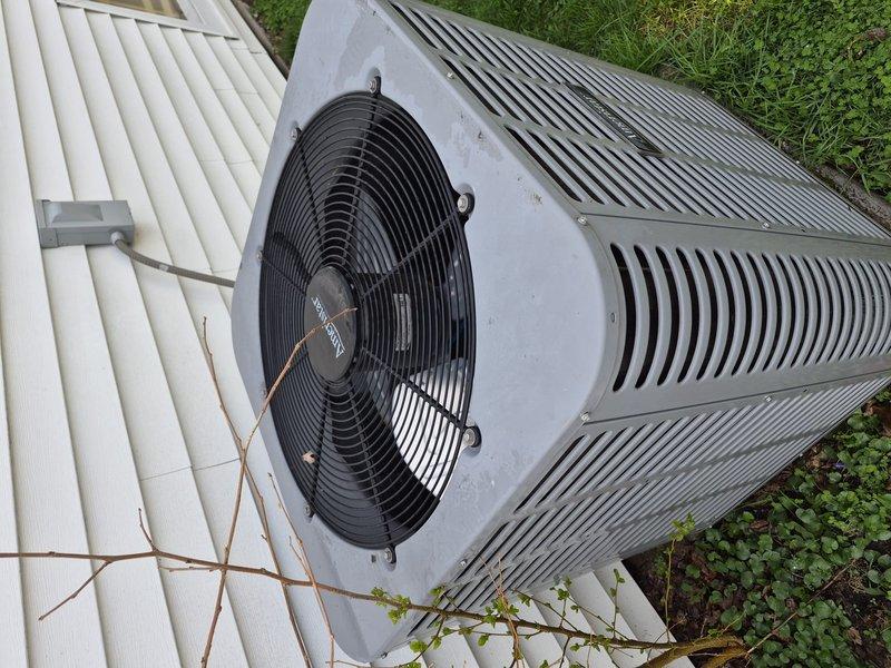 Completed annual air conditioning clean and check maintenance on Ducane outdoor condensing unit per comfort plan agreement. Performed comprehensive system inspection, cleaned condenser coils and fan assembly, removed debris from unit top and surrounding area, verified proper operation of all components, and confirmed unit specifications and manufacturer labeling were intact and legible.