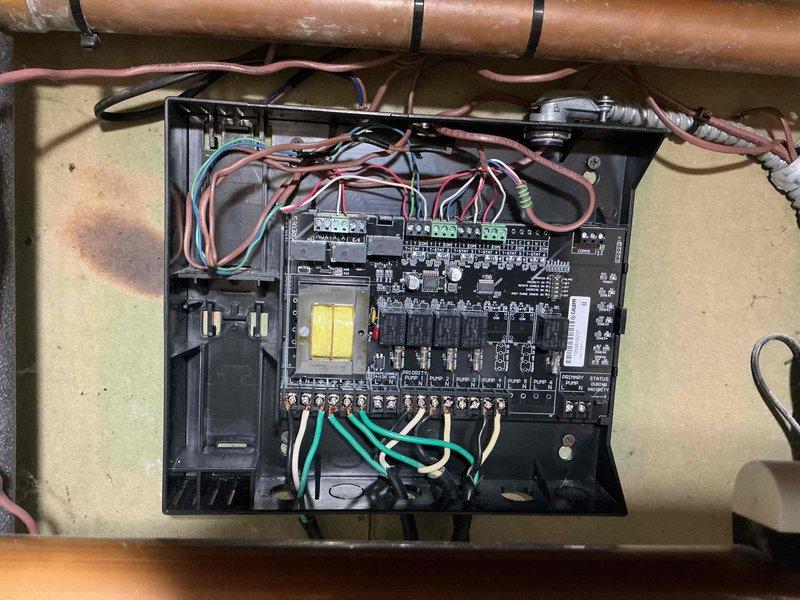 Replaced defective Caleffi zone valve in hydronic heating system and verified proper operation of all three zone circulators. Removed failed valve from control panel assembly and installed new replacement unit, reconnecting all wiring to circuit board terminals and ensuring secure electrical connections. Tested system operation to confirm zone valve actuates correctly and circulator pumps respond appropriately to thermostat calls.