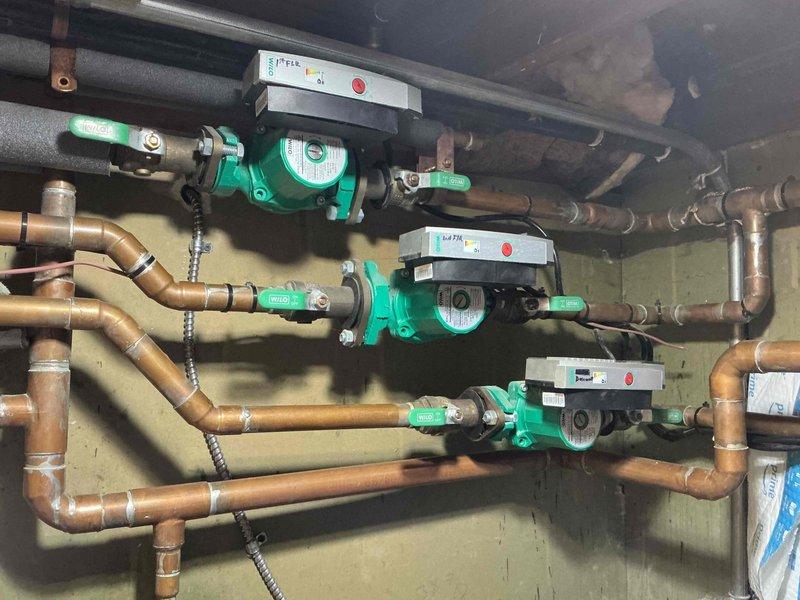 Replaced defective Caleffi zone valve in hydronic heating system and verified proper operation of all three zone circulators. Removed failed valve from control panel assembly and installed new replacement unit, reconnecting all wiring to circuit board terminals and ensuring secure electrical connections. Tested system operation to confirm zone valve actuates correctly and circulator pumps respond appropriately to thermostat calls.