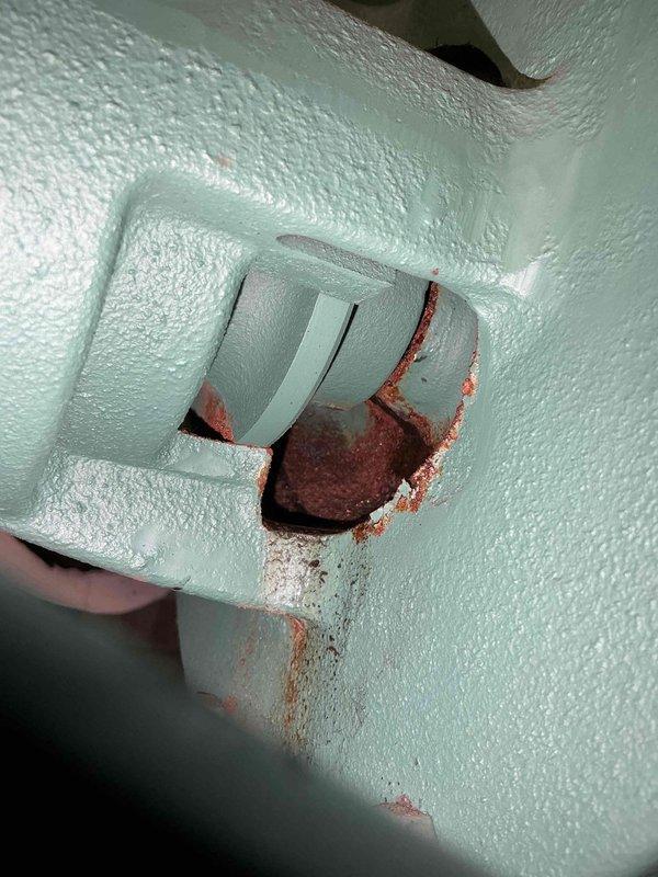 Responded to water leak in commercial boiler room. Upon inspection, identified significant corrosion and rust staining around copper pipe penetration through wall, indicating active leak at pipe junction. Documented conditions with photographs showing water damage on floor near HVAC equipment including air handling units and circulation pumps. Unable to complete repair onsite; provided quote for corrective action to address pipe leak and corrosion damage.