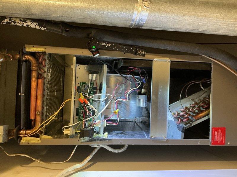 Performed comprehensive tune-up and maintenance on a residential split HVAC system with rooftop condensing unit and attic-mounted air handler. Conducted electrical diagnostics using digital multimeter to verify proper voltage and amperage readings at all major components including compressor, condenser fan motor, and blower motor. Inspected all electrical connections, control boards, and wiring harnesses for integrity and proper operation. Examined evaporator coil, refrigerant lines, and blower assembly within air handler cabinet. Replaced 12x20x1 air filter to ensure proper airflow and system efficiency. Verified all safety controls, capacitors, and contactors functioning within manufacturer specifications. System operating normally upon completion of tune-up service.