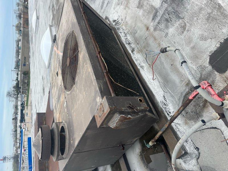 Verified refrigerant removal from two decommissioned RTUs on Unit D rooftop. Removed gas lines from warehouse area, eliminated associated roof penetrations, and capped all gas line termination points inside warehouse at nearest connection locations. Coordinated with contractor support utilizing scissor lift for safe rooftop access to complete demolition work on aged HVAC equipment and associated utility connections.
