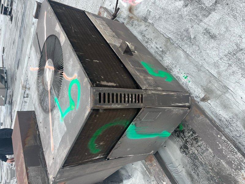Verified refrigerant recovery on two decommissioned rooftop units in Unit H area, confirming proper removal with visual inspection markings. Removed exposed gas lines from rooftop surface and relocated them below the roof line into the warehouse through existing roof access point. Utilized scissor lift to safely access and complete all rooftop work on the weathered membrane surface.