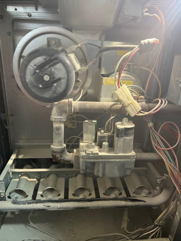 Completed estimate for full HVAC system replacement at residential property. Evaluated existing 34-year-old air conditioning condenser unit and gas furnace, both showing significant age-related wear and operational decline. Outdoor condenser unit exhibits weathering, discoloration, and compromised efficiency typical of equipment exceeding expected service life. Interior furnace components including gas valve assembly, burner assembly, blower motor, and draft inducer were inspected and documented. Provided comprehensive replacement options for complete system upgrade, discussed available financing programs, and documented existing equipment configuration including electrical disconnect, refrigerant lines, and current installation setup for accurate replacement specifications.